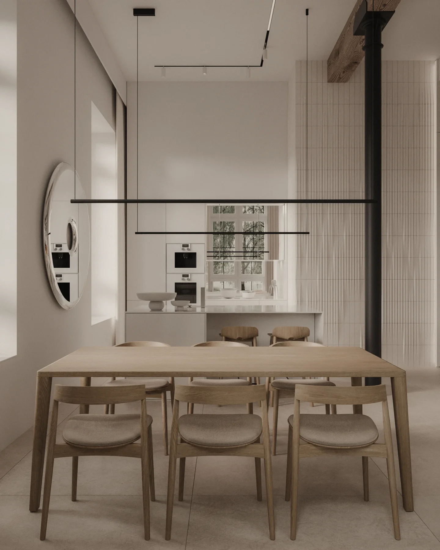 Projekt jadalni połączonej z kuchnią w stylu soft loft. Naturalny drewniany stół z krzesłami, wiszące oprawy liniowe, okrągłe lustro i industrialne akcenty w tle.